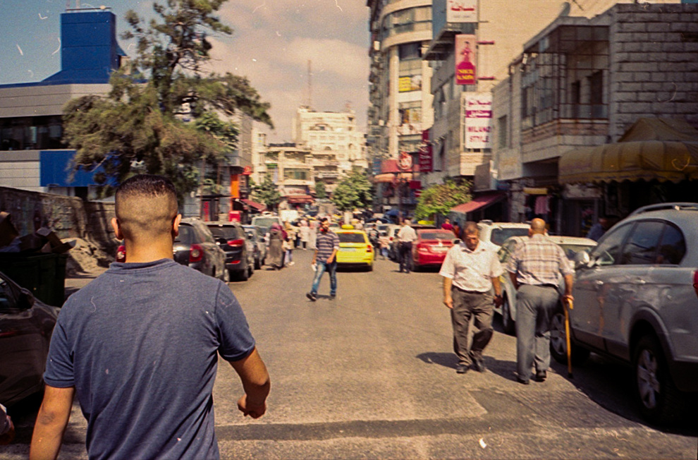 People and traffic on a busy street.
