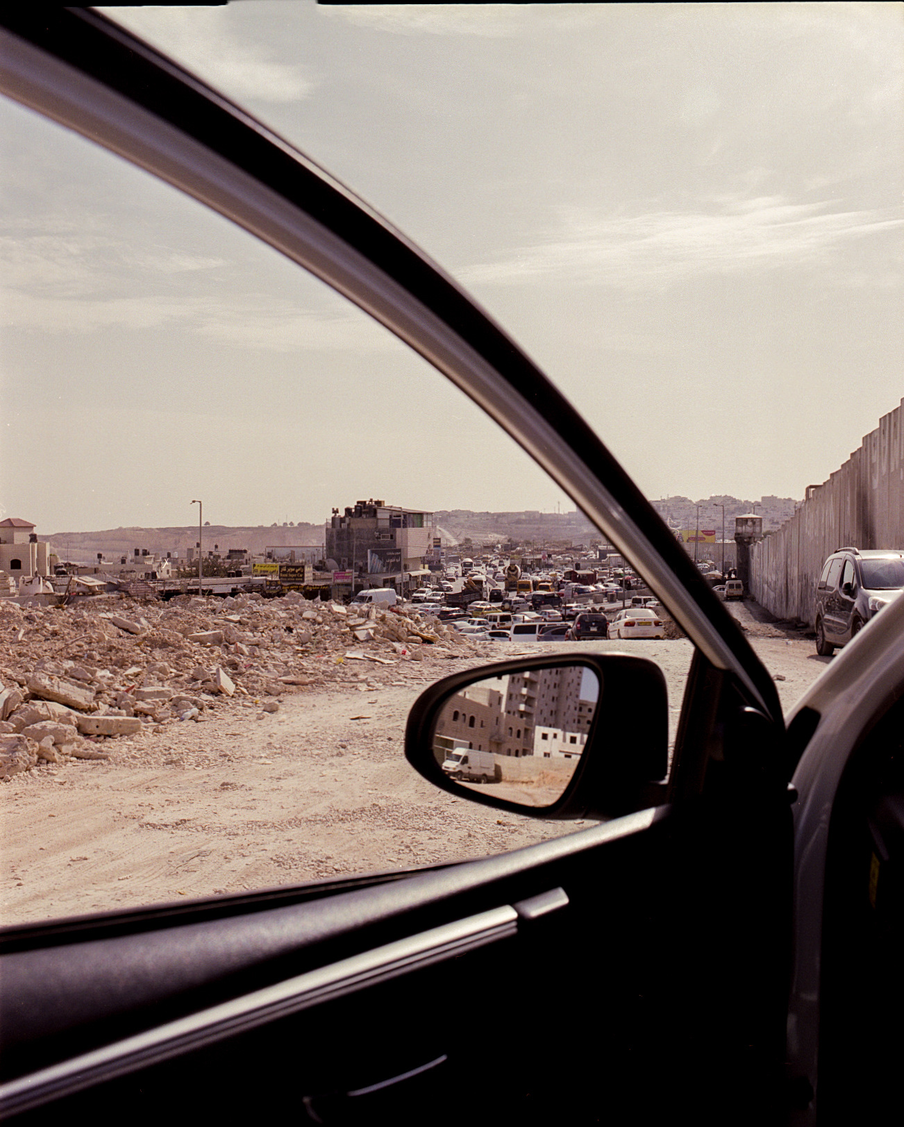 The landscape seen through an open car window.