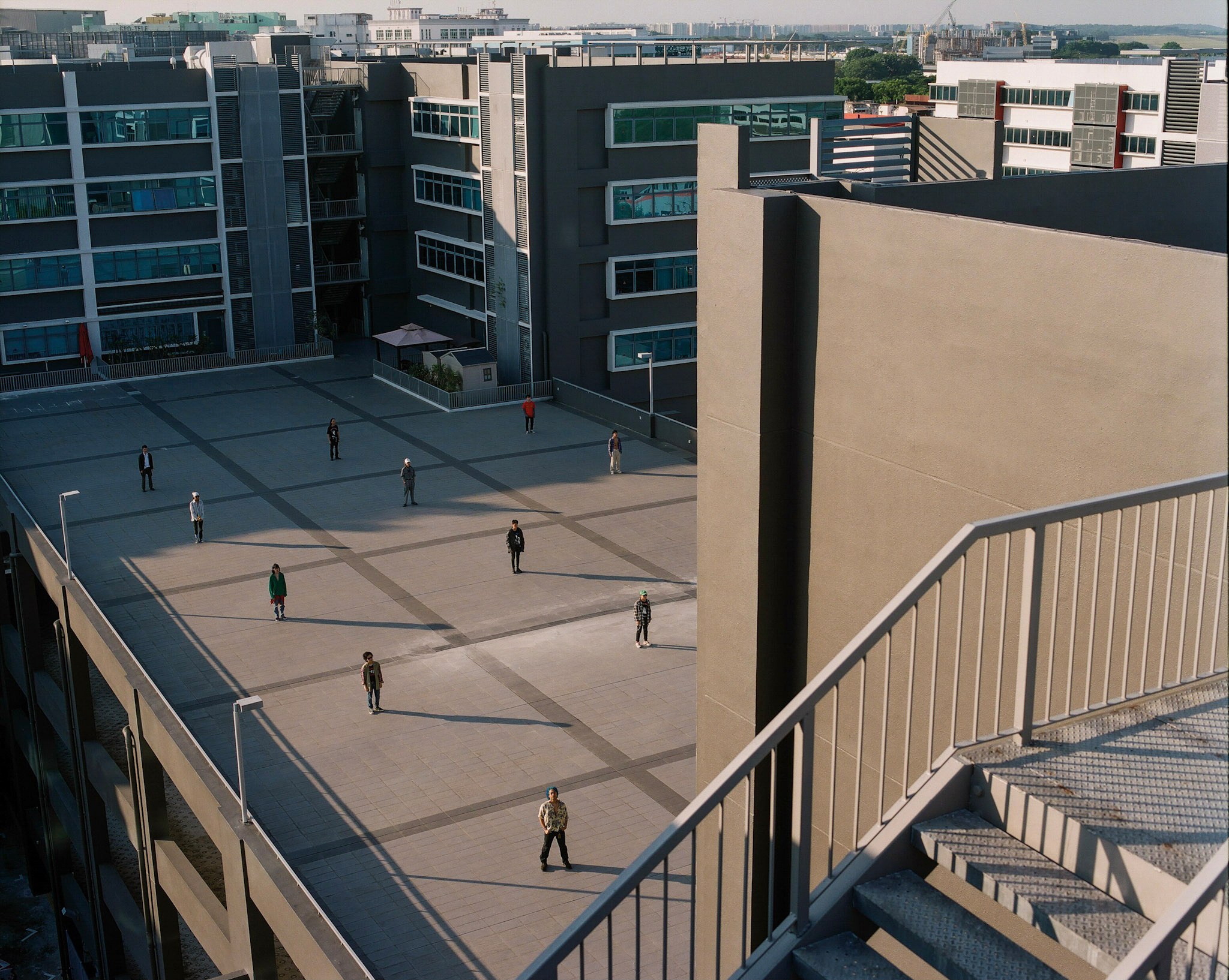 Rooftops and a stairwell seen from above.