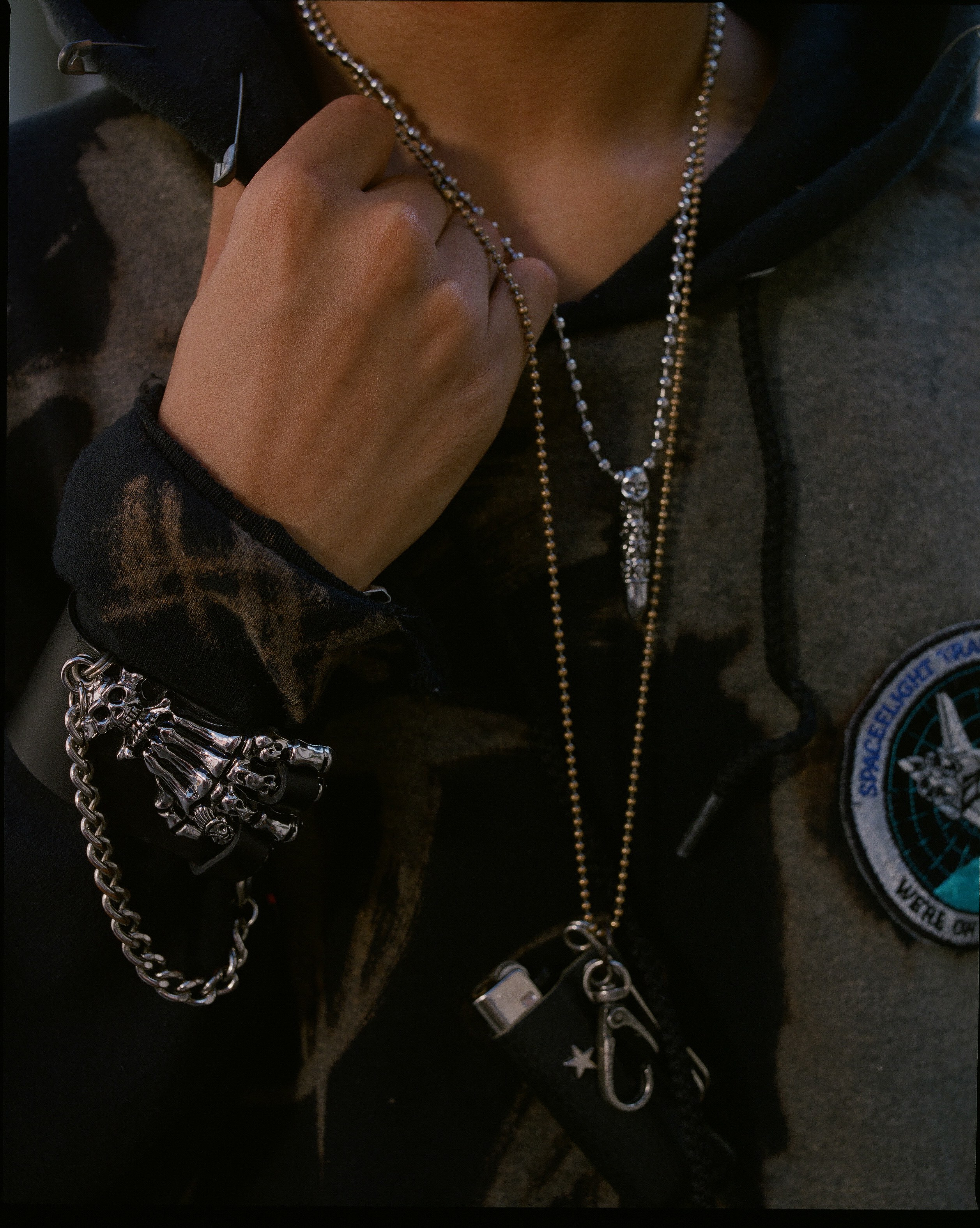 A close view of necklaces and chains.