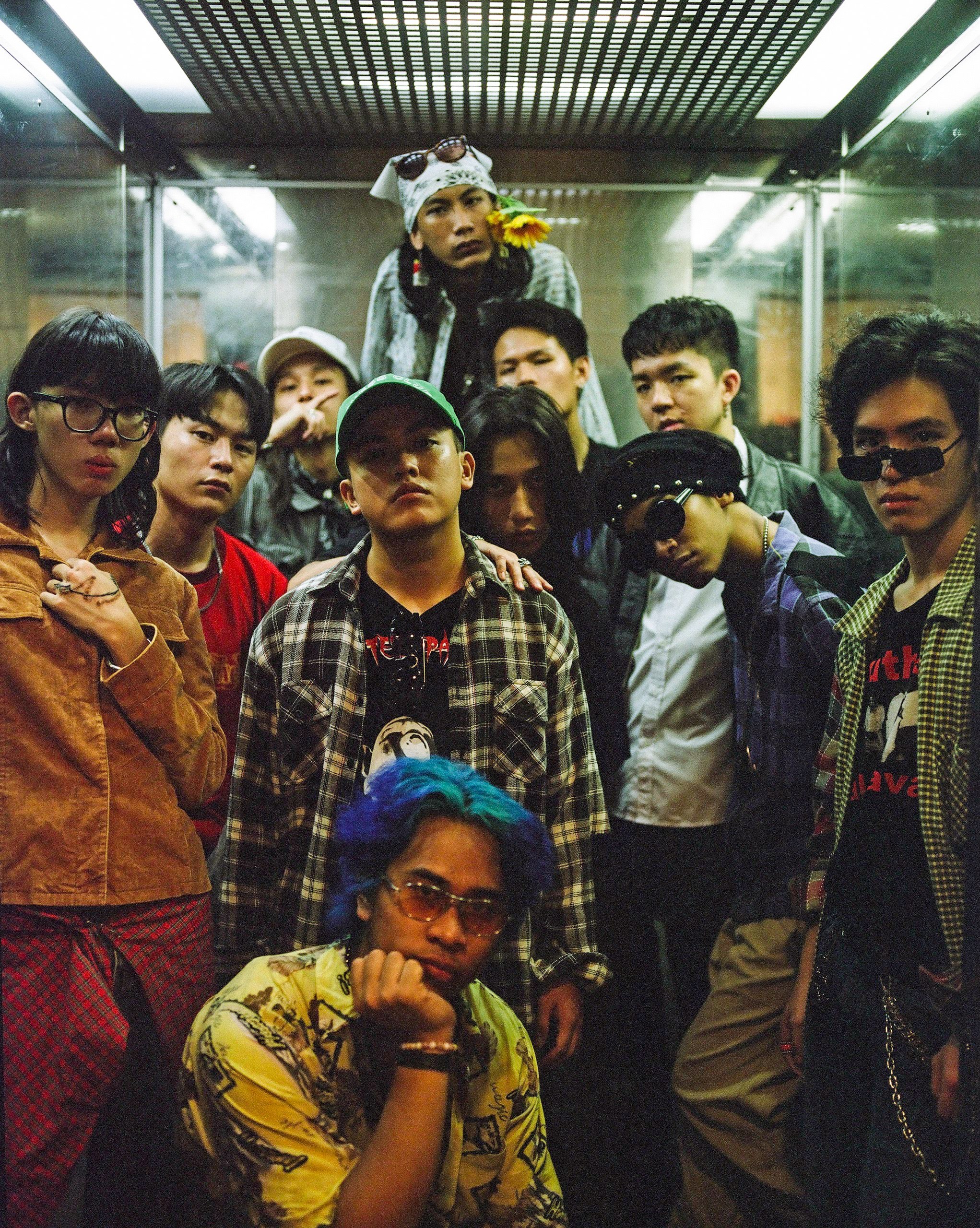 The group together in a lift.