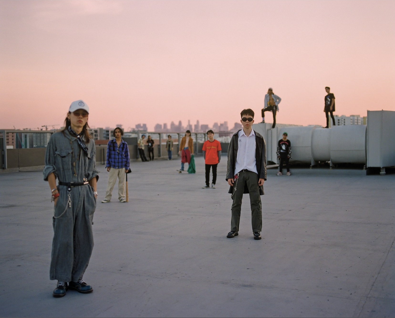Youths in Balaclava on a rooftop at dusk