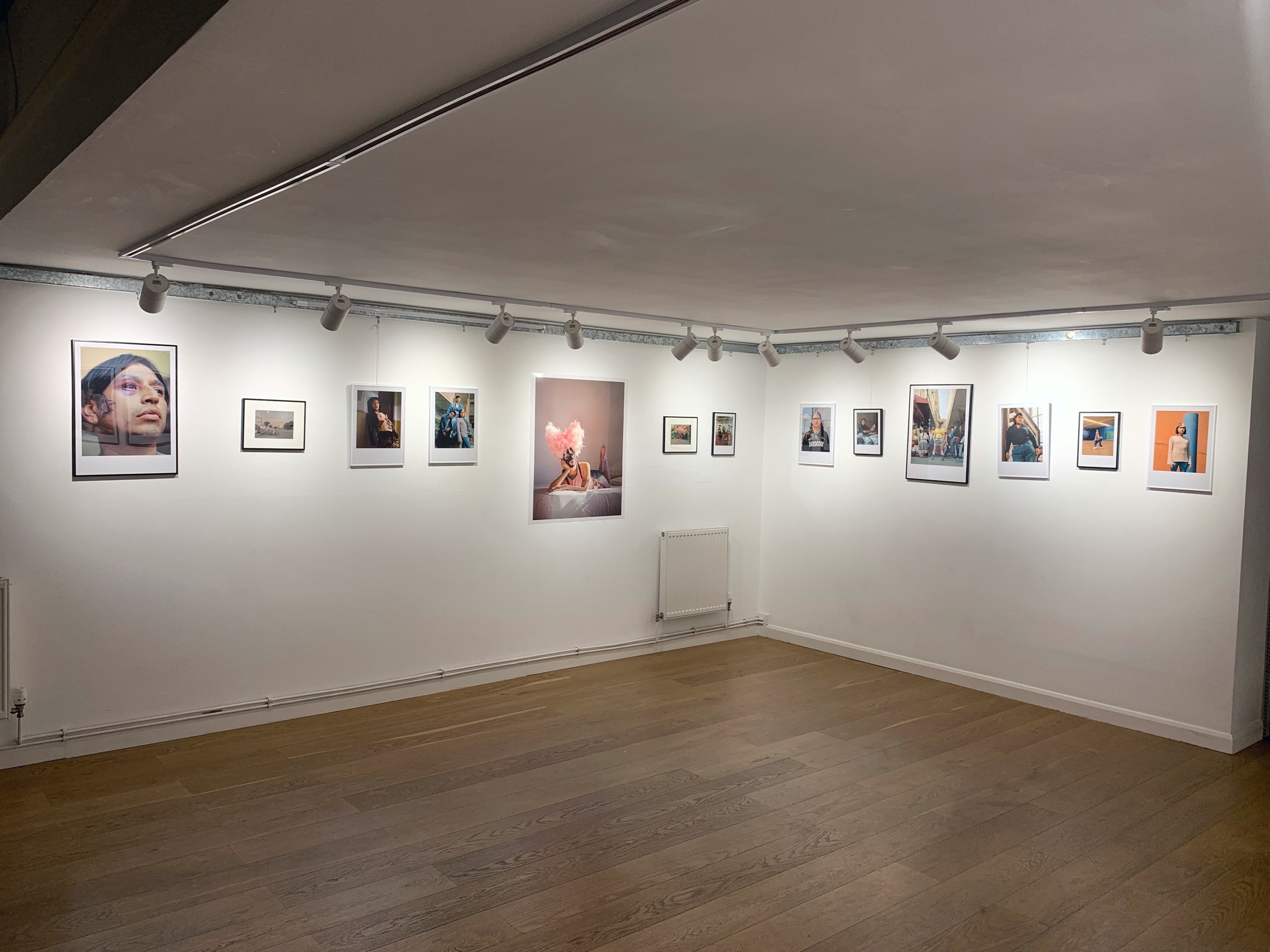 Installation view of framed photographs from A Caged Dog Barks the Fiercest at Allotment.