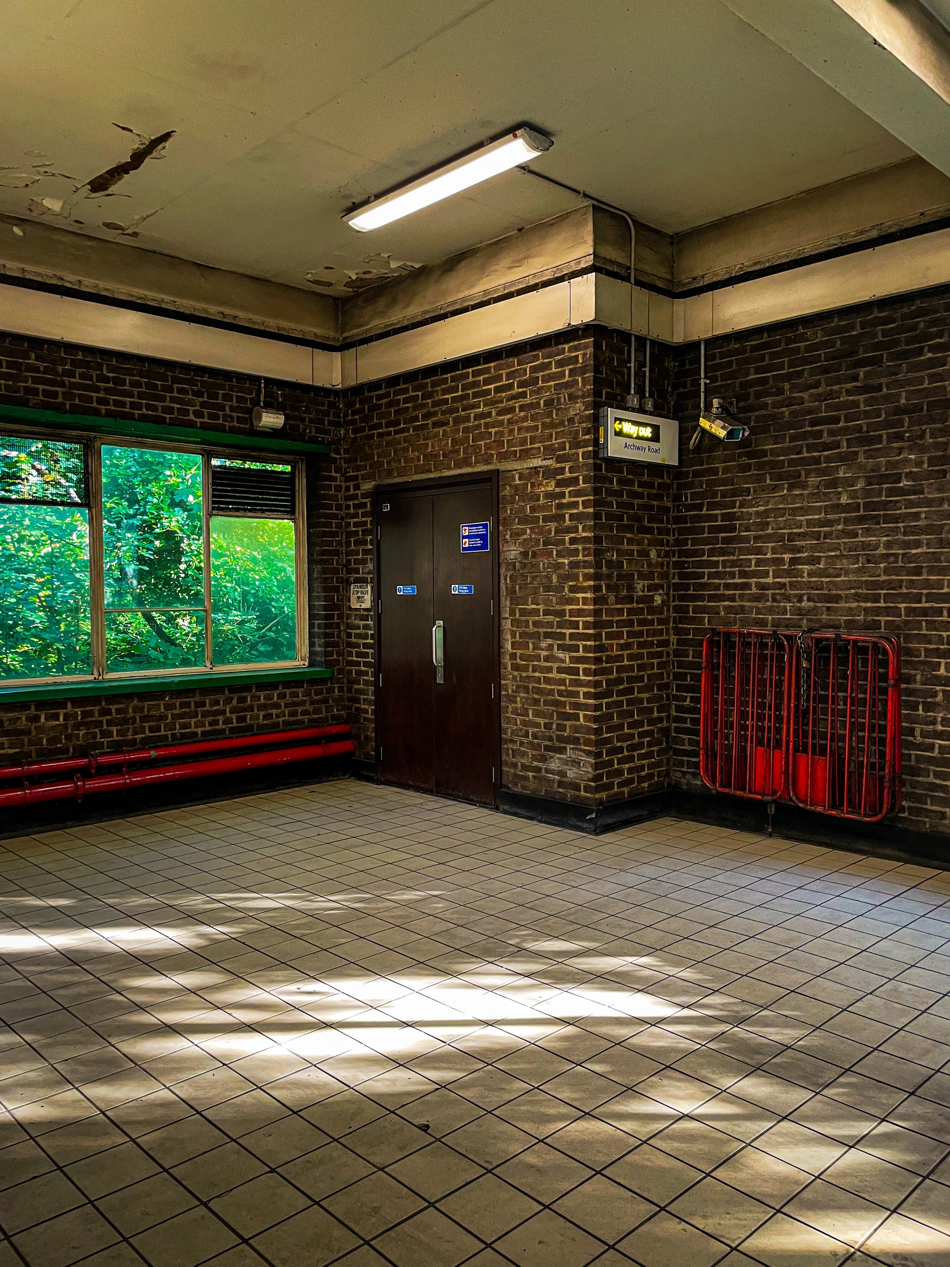 Sunlit tiled station interior.