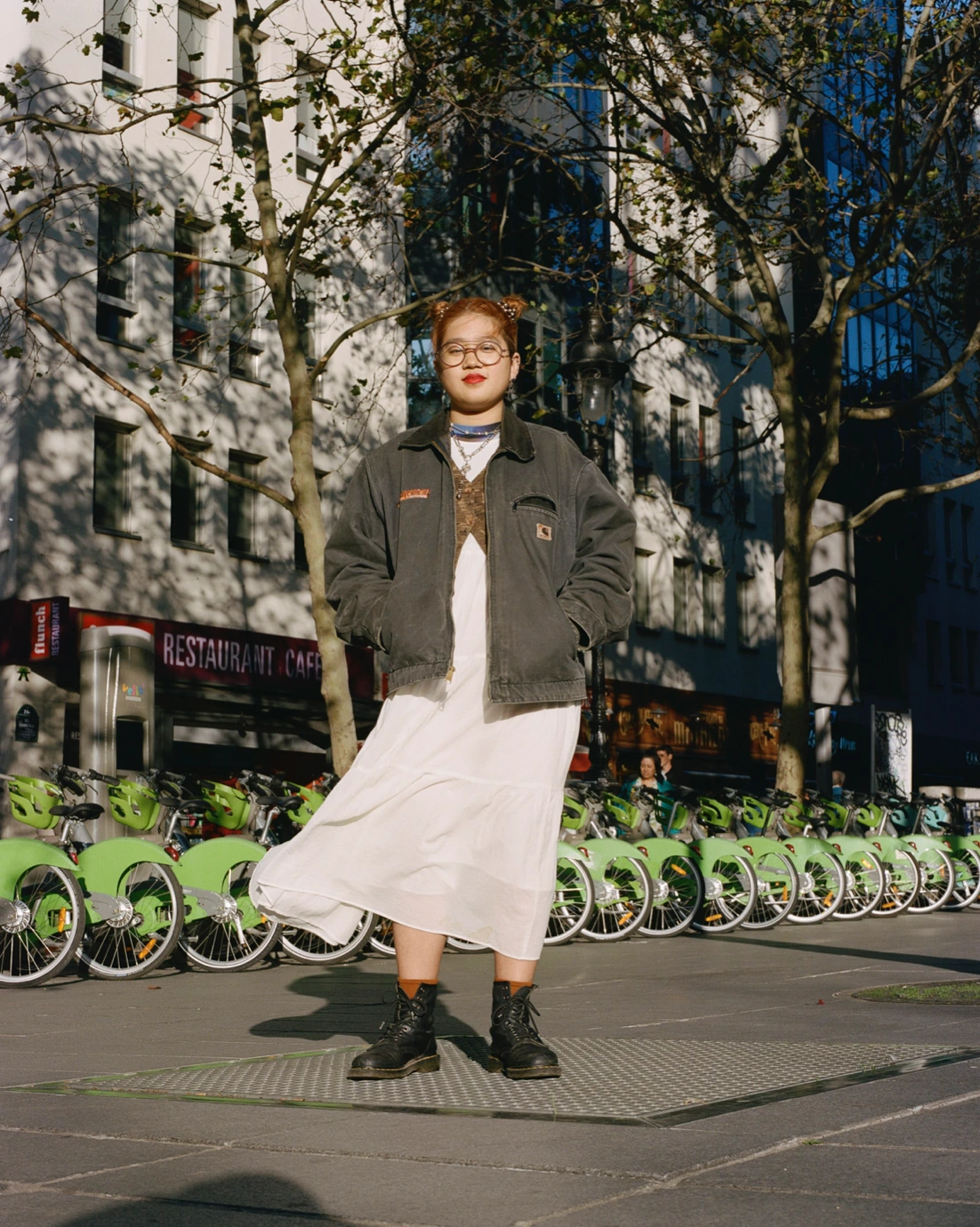 Street portrait beside bicycles.