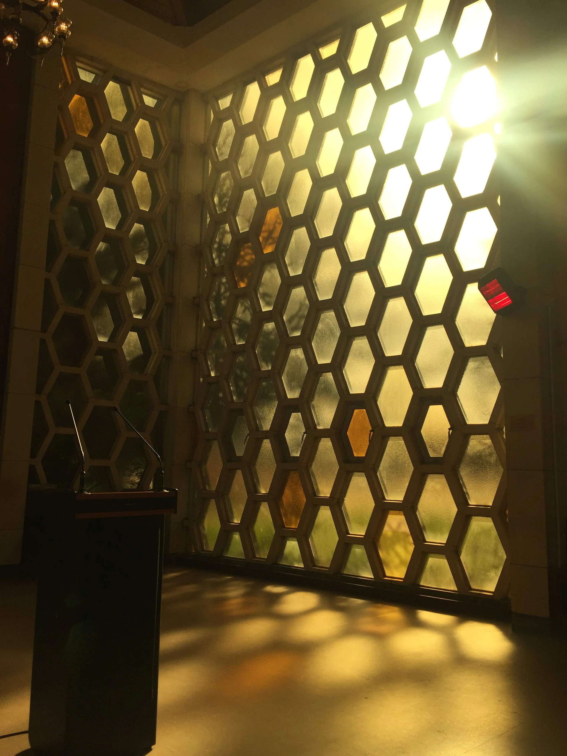 Sunlight through patterned screen.