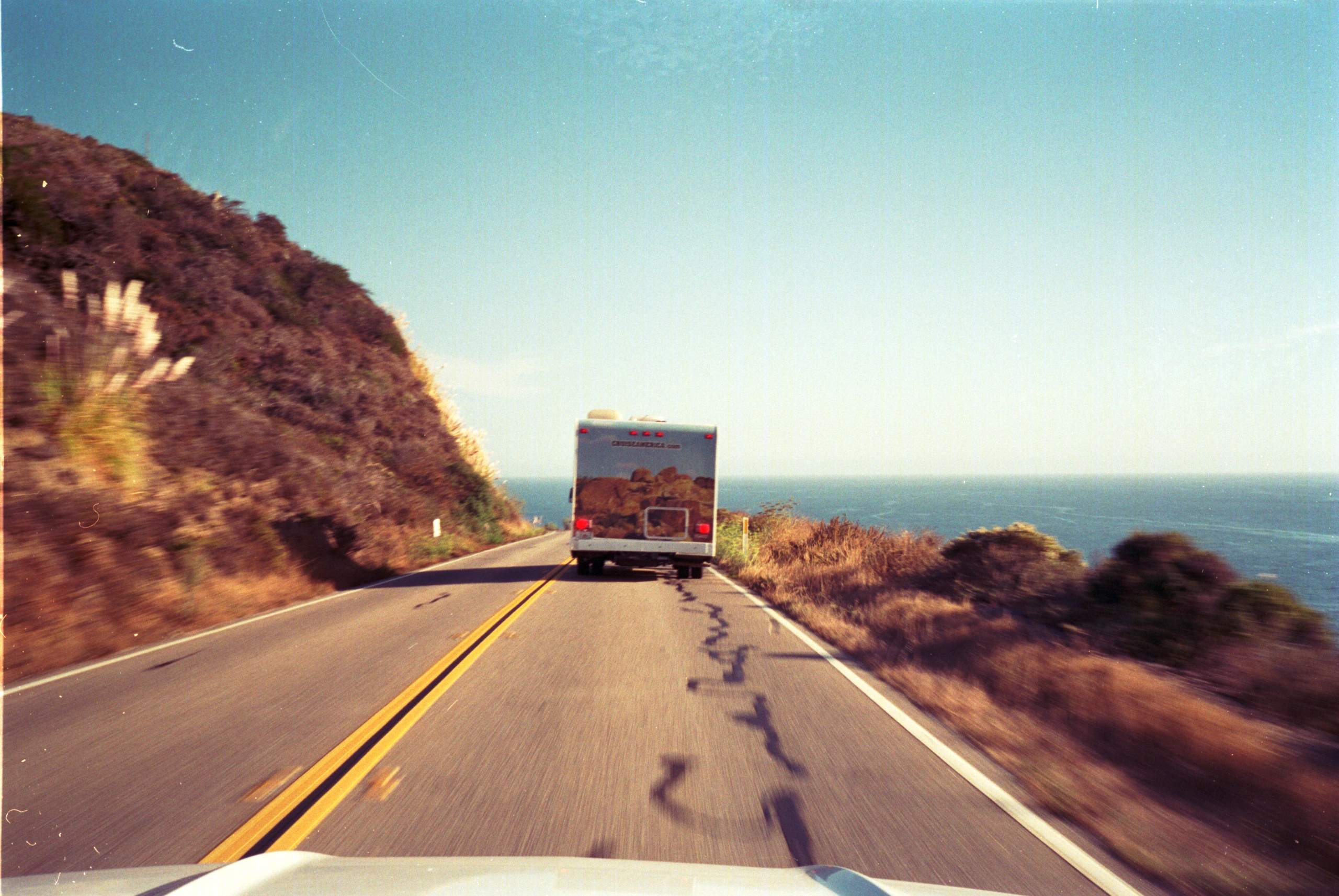 Lorry on coastal road.