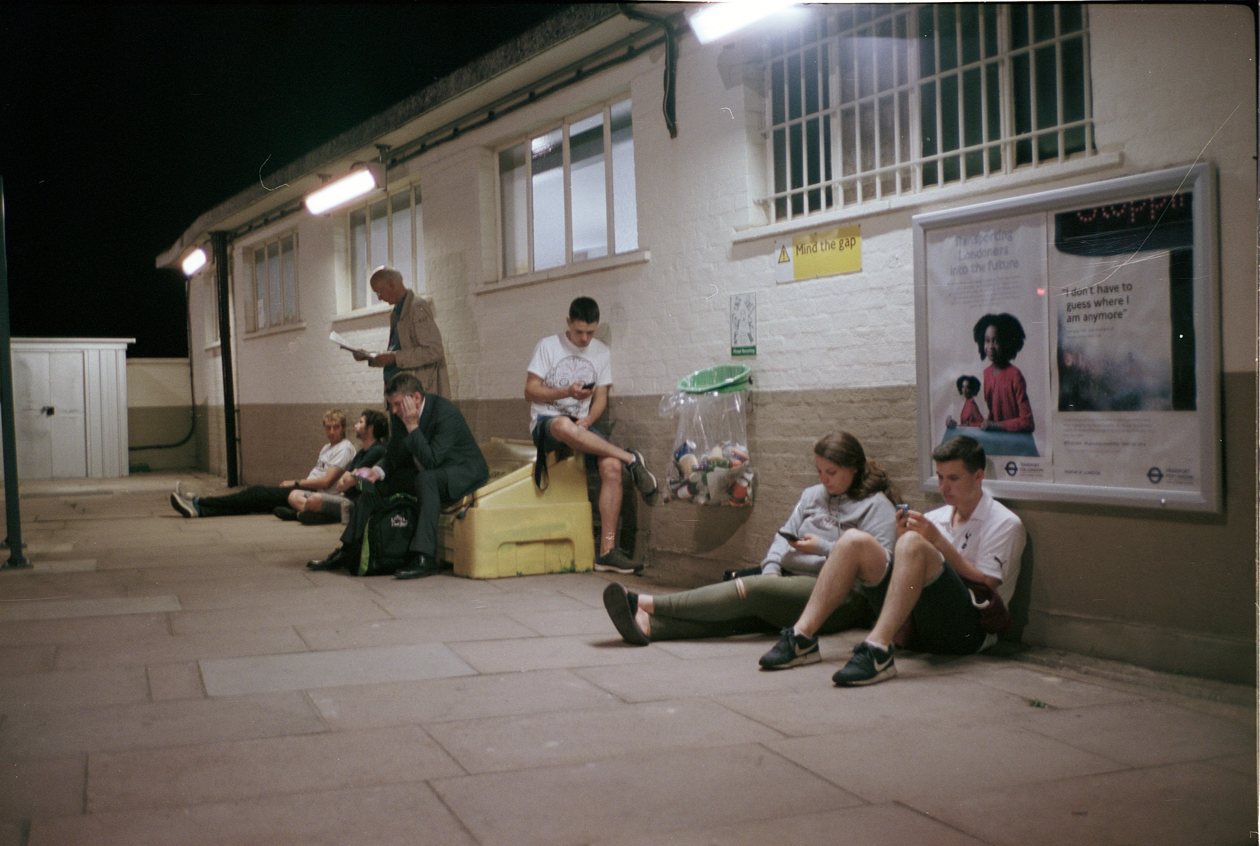Group outside building at night.