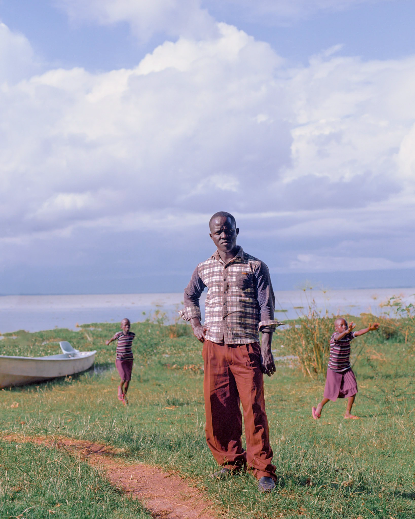 Man beside lake.