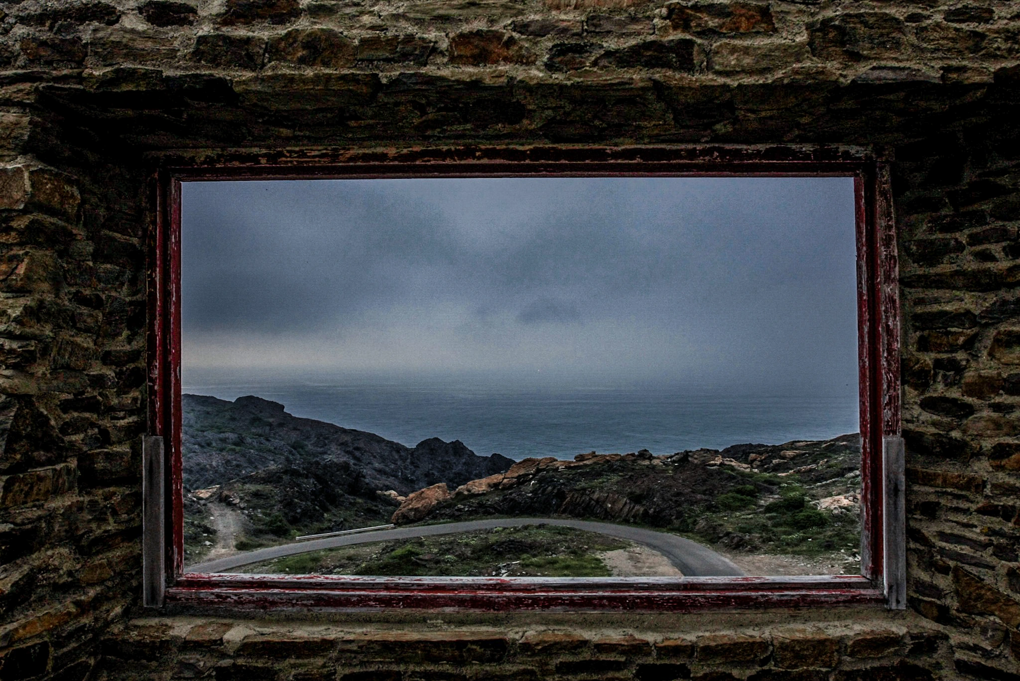 Landscape through stone window.